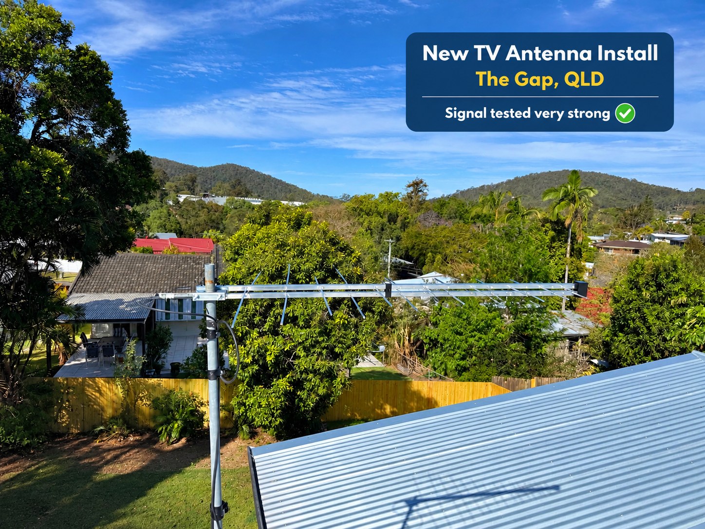Completed TV antenna on a metal rooftop at The Gap, with the mast and cable visible